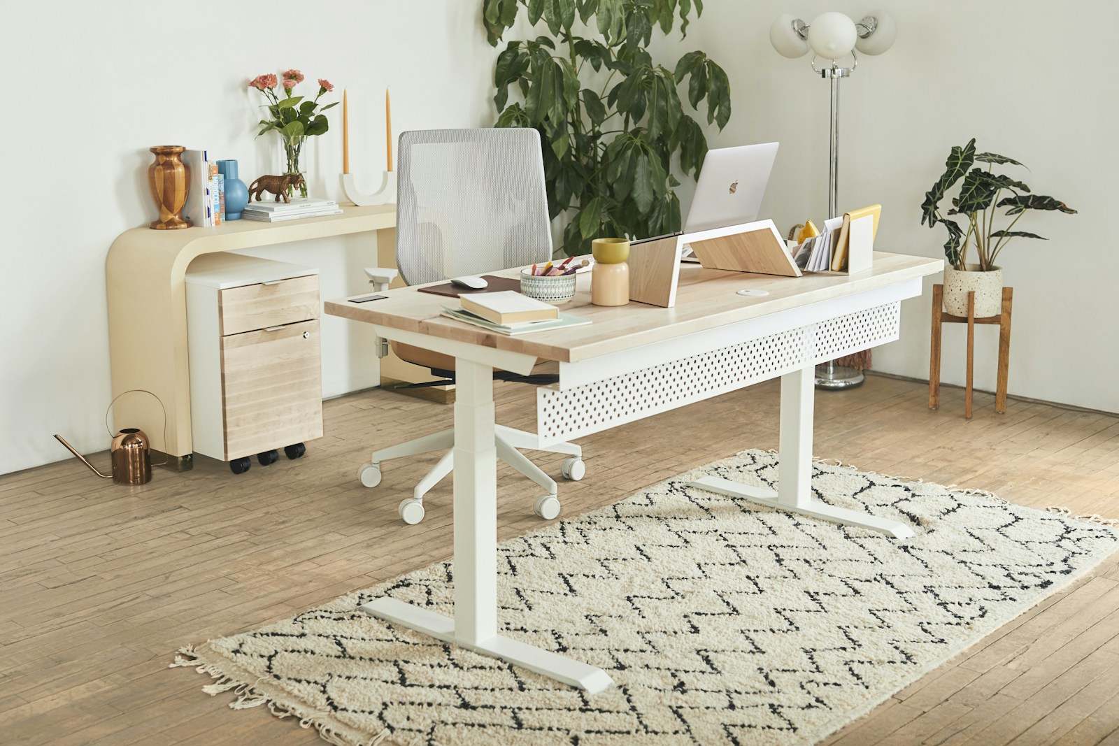 A bright creative workspace with computers, plants, and room for new ideas